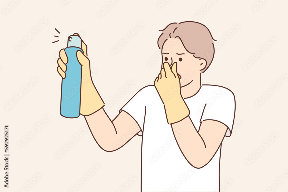 Ταπετσαρία Dissatisfied man with spray to remove unpleasant odors covers nose with hand spr