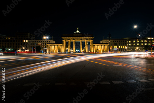 Long exposure of car headlights and the beauty of Brandenburg Gate in Berlin at night