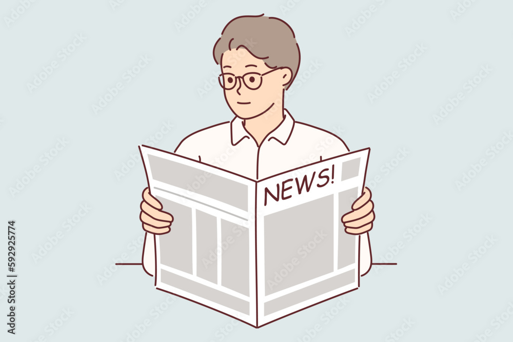 Φωτογραφία Man holds newspaper reading news about latest business events and political chan