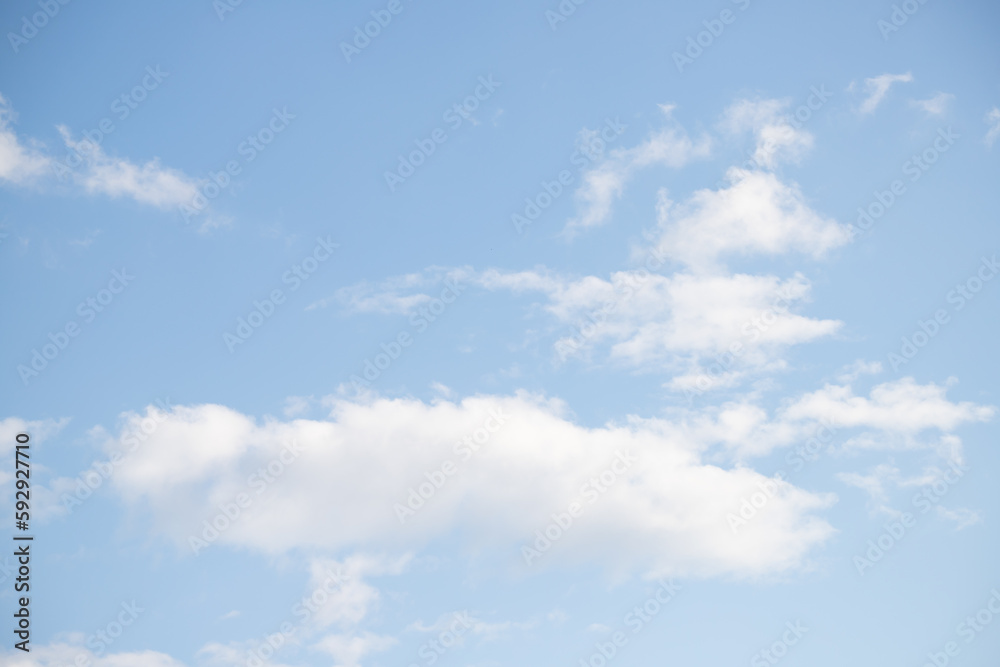 Blue sky with white fluffy clouds in sunny weather. Blue sky with white fluffy clouds in sunny weather.