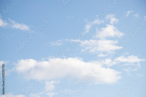Fototapeta Naklejka Na Ścianę i Meble -  Blue sky with white fluffy clouds in sunny weather.