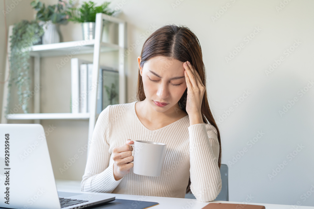 Young beauty asian woman headache when drink hot coffee Young beauty asian woman headache when drink hot coffee