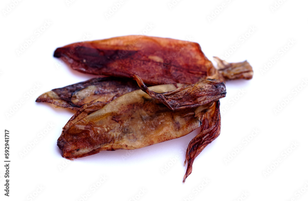 Dried squids for cooking isolated on white background. Concept food preservation. Seafood. Dried on sunshine and keep for eating or selling. Delicious and can be cooked. Dried squids for cooking isolated on white background. Concept food preservation. Seafood. Dried on sunshine and keep for eating or selling. Delicious and can be cooked.
