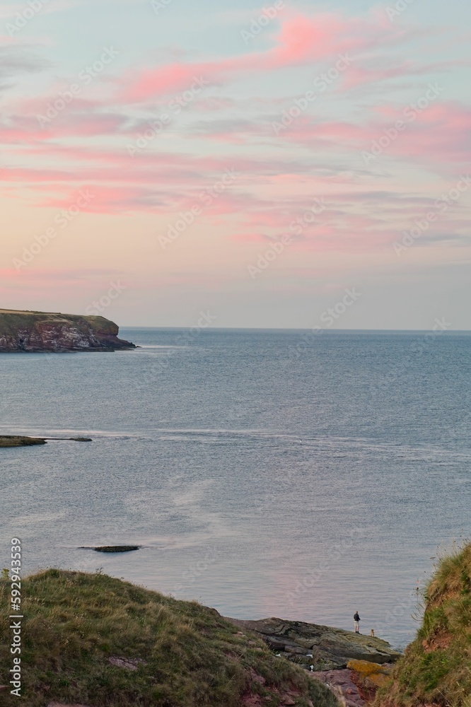 Beautiful landscape of the Carlingheugh Bay, near Arbroath, Scotland under glorious skies
