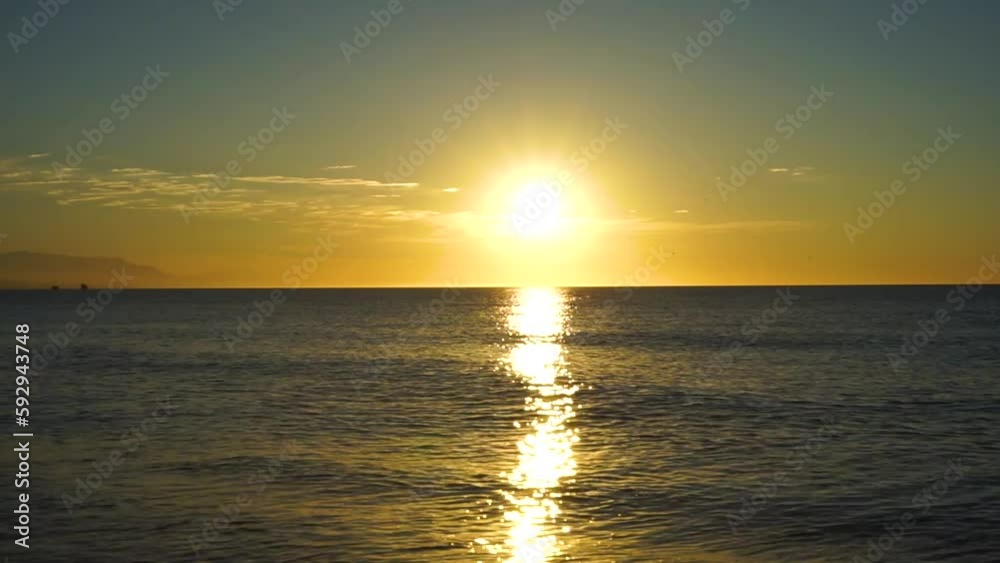 Bright orange sunrise over Mediterranean Sea. Morning sky for meditation. Calm seascape. Costa del Sol, Malaga, Spain Bright orange sunrise over Mediterranean Sea. Morning sky for meditation. Calm seascape. Costa del Sol, Malaga, Spain