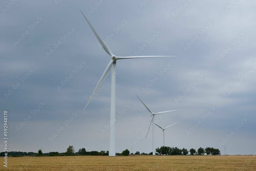 Beautiful shot of a windmill in a large field Beautiful shot of a windmill in a large field