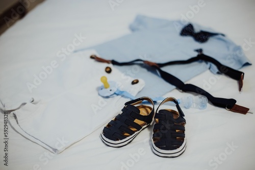 Top-angle view of a fashionable outfit for a baby boy, on a white background