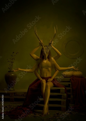 Asian Halloween model with multiple hands wearing deer skull