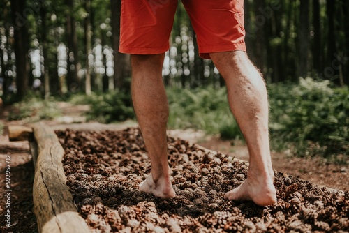 A path made of twigs to walk on barefoot, man walking