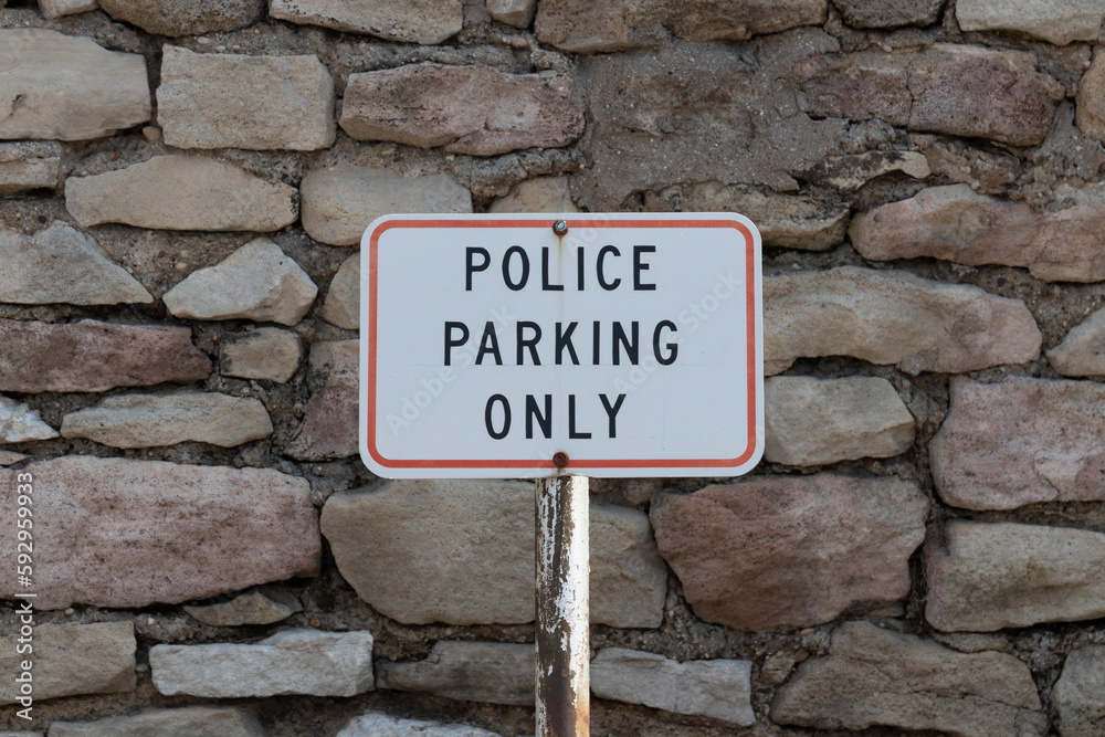 Police Parking Only sign at a police station. The police have a duty to enforce the laws of its jurisdiction. Police Parking Only sign at a police station. The police have a duty to enforce the laws of its jurisdiction.