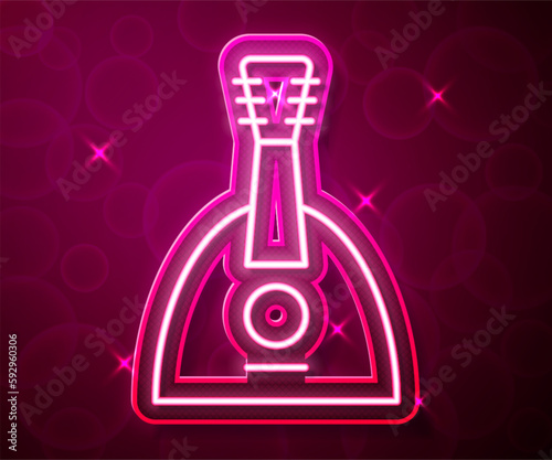 Glowing neon line Musical instrument balalaika icon isolated on red background. Vector