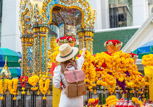 Obraz na płótnie Asian woman travel in erawan shrine Bangkok city