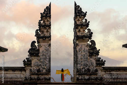 Indonesia gate in temple in Bali with indonesian woman