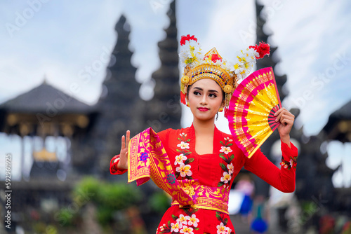 Indonesian girl with traditional costumn dance in bali temple