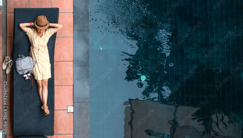 Asian woman relax in resort and swimming pool in Hotel in Chiangmai