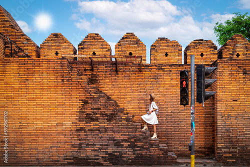 Canvas-taulu Asian traveller woman walking on the street of Chiang mai