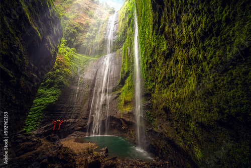 Asian traveller Man in Madakaripura Waterfall photo