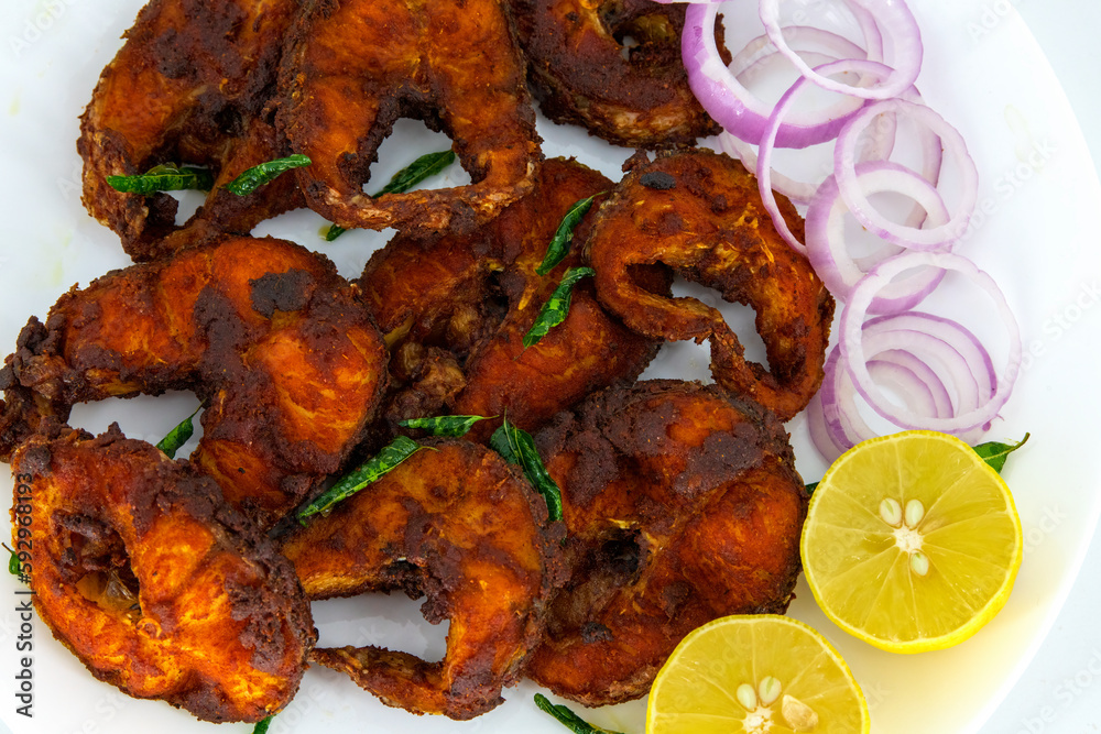 Cooking deep frying of crispy tasty fish sea food in plate with low oil