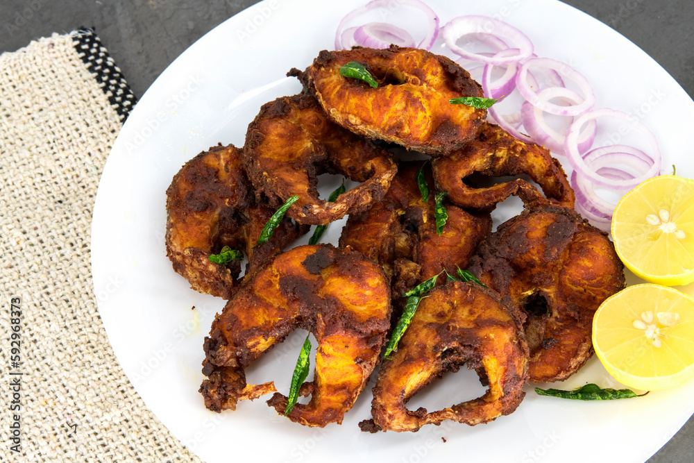 Cooking deep frying of crispy tasty fish sea food in plate with low oil