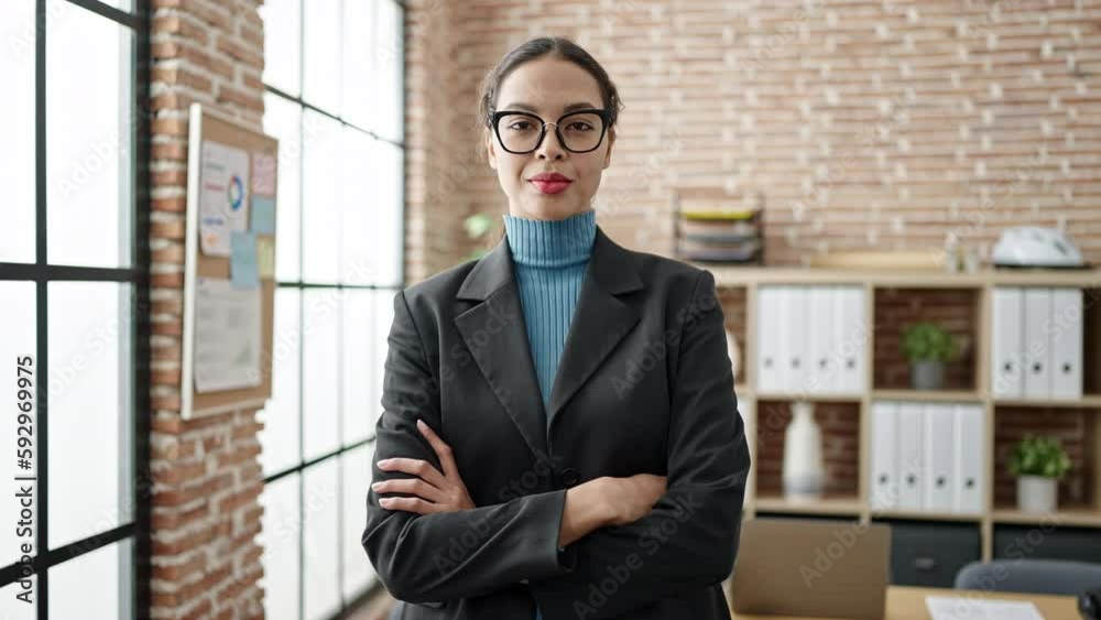 Young beautiful hispanic woman business worker smiling confident at office Young beautiful hispanic woman business worker smiling confident at office