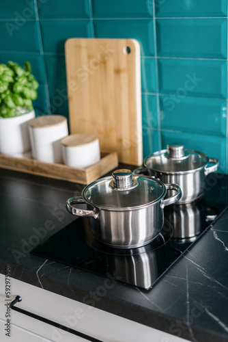 cooking pot on induction hob at home kitchen