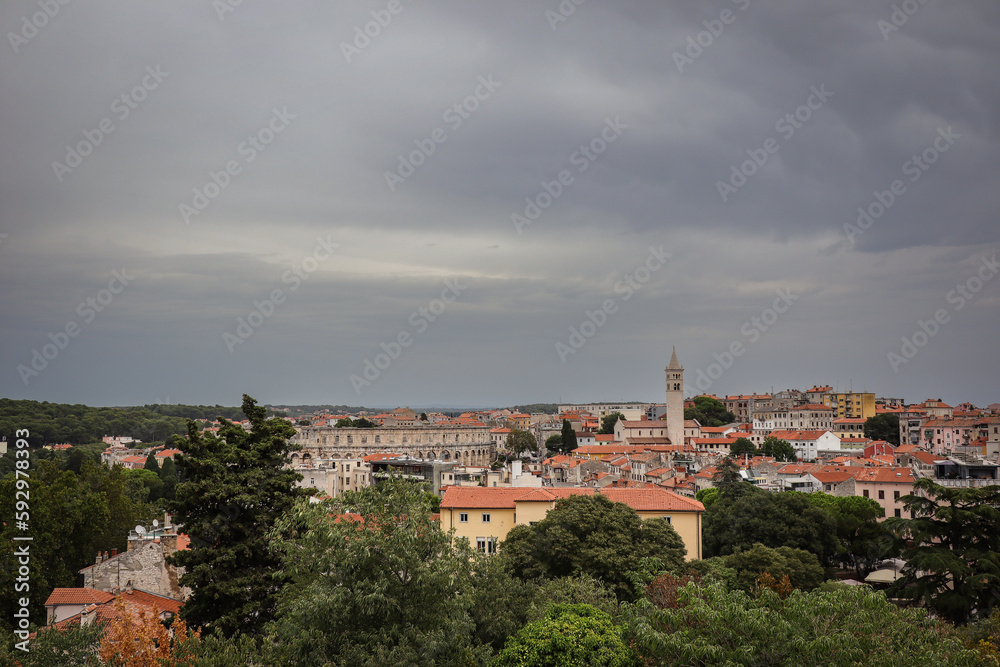 View of Pula City during Cloudy Day. Scenery of Istrian Town with its Monuments in Croatia.