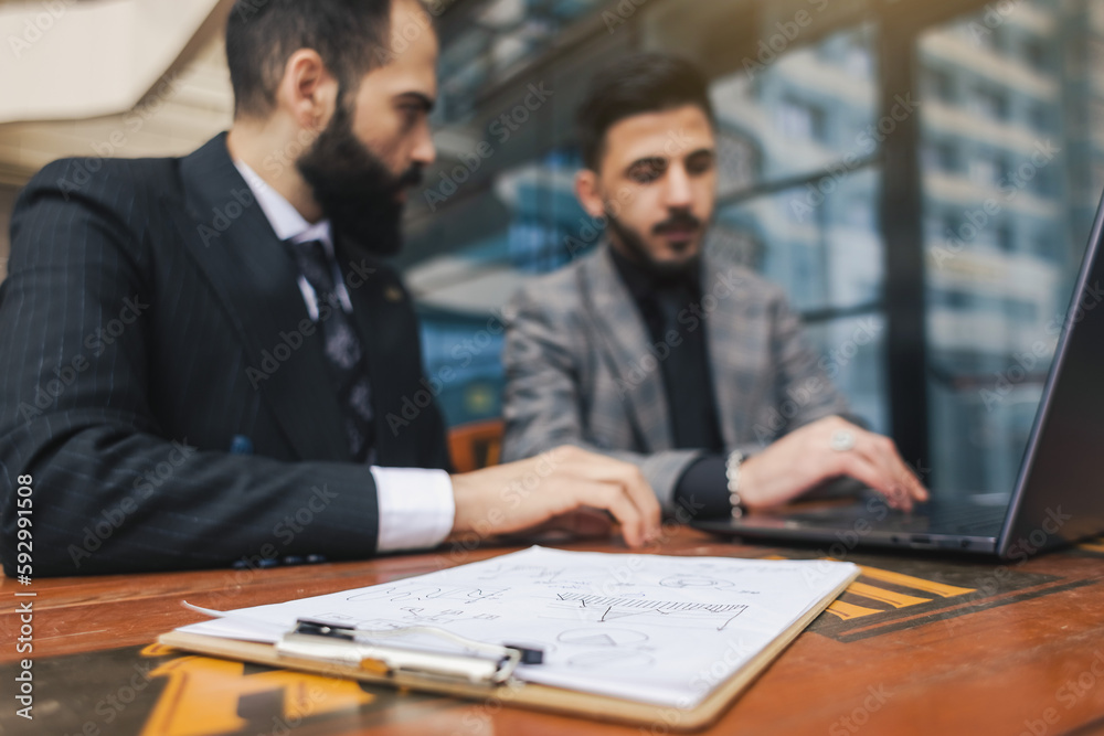 business people meets outdoors. Two men are using a laptop. Working break. Team and business support. Collaboration and partnership business people meets outdoors. Two men are using a laptop. Working break. Team and business support. Collaboration and partnership