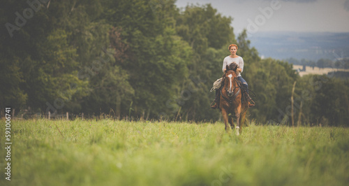 Pretty, young, redhead woman with her lovely horse, during her favorite leisure © lightpoet