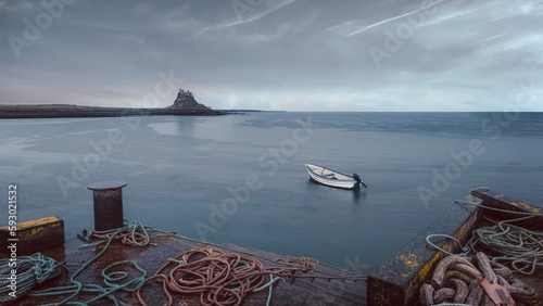 harbor view of boat and the castle at Holy Island 