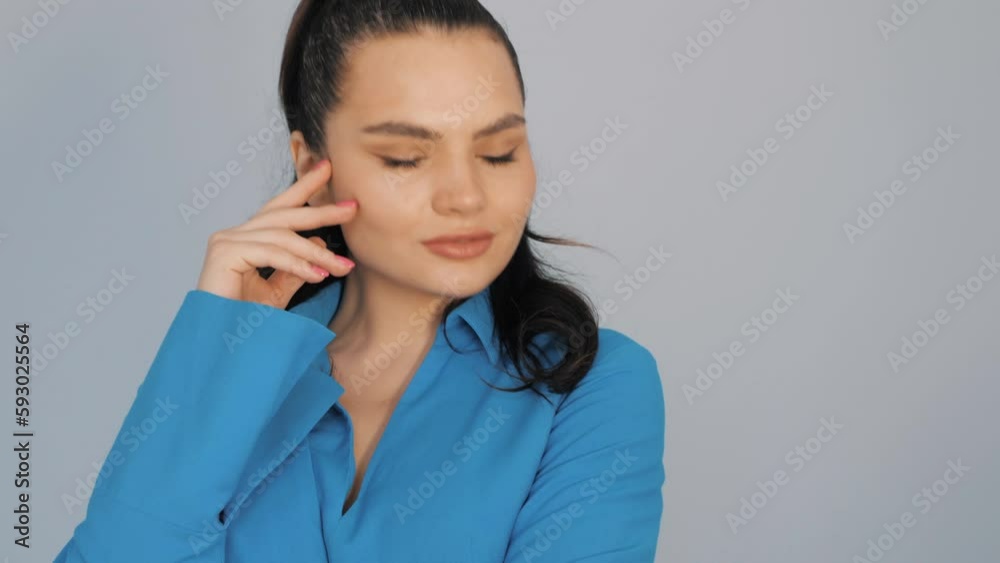 High fashion portrait of young beautiful brunette woman wearing nice trendy summer dress. fashion model posing near light blue wall in studio. Fashionable female indoors High fashion portrait of young beautiful brunette woman wearing nice trendy summer dress. fashion model posing near light blue wall in studio. Fashionable female indoors
