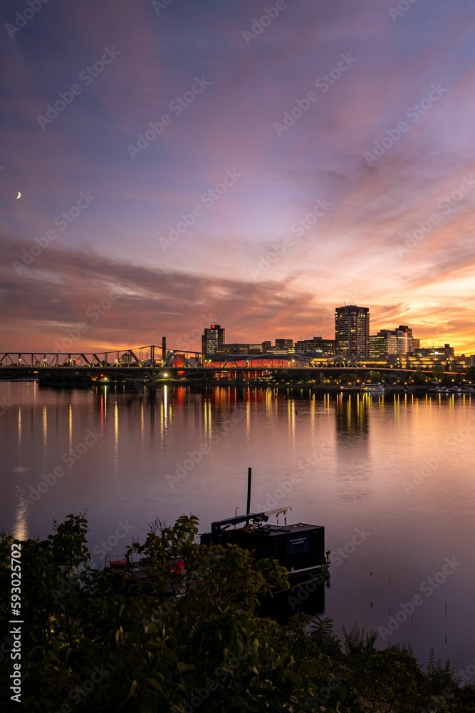 Long exposure shot of Gatineau under a colorful sunset sky with the moon