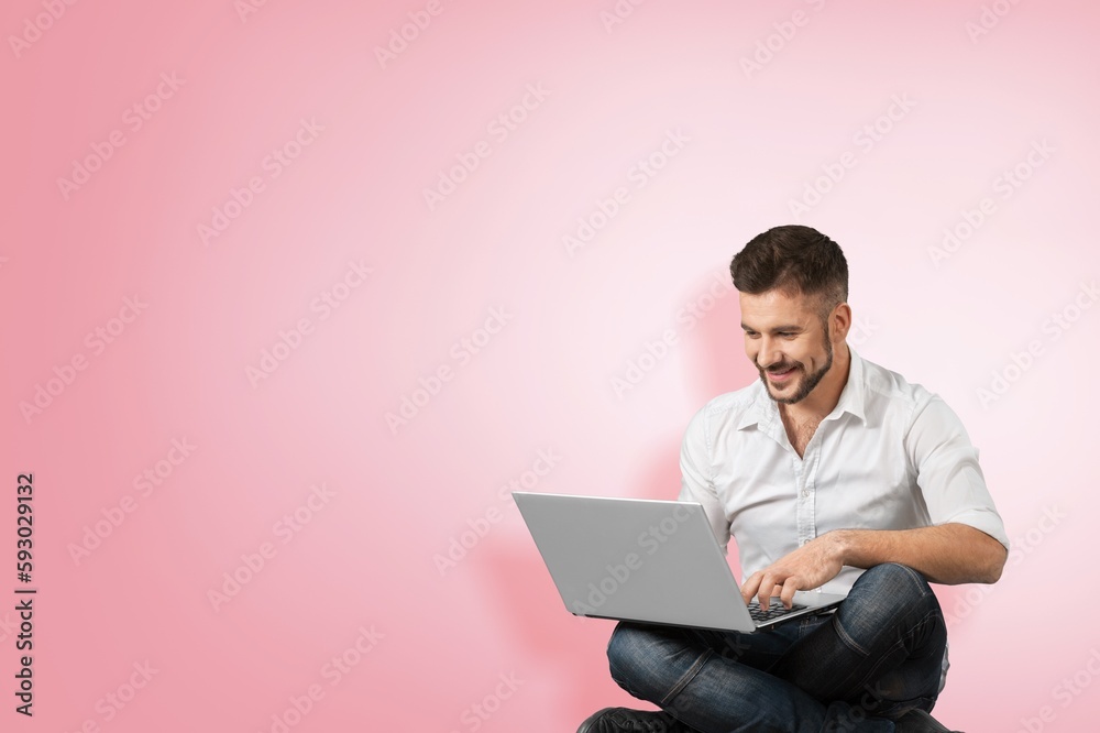 Positive young student hold laptop