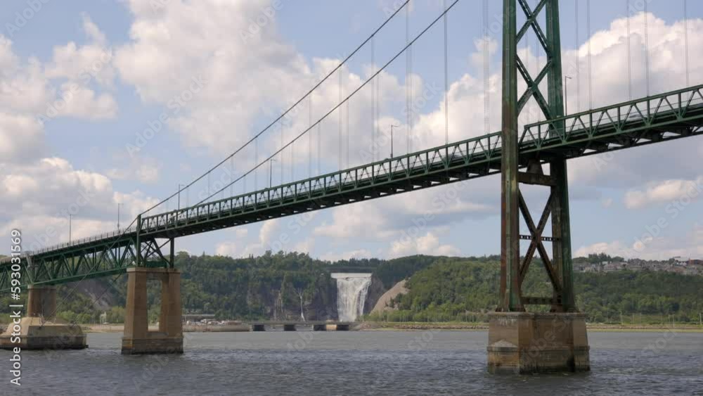 Huge bridge in Quebec with a waterfall in the background on a sunny day, Canada Huge bridge in Quebec with a waterfall in the background on a sunny day, Canada