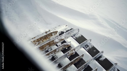 Modern snowcat ratrack with snowplow,snow grooming machine,remover truck preparing ski slope 