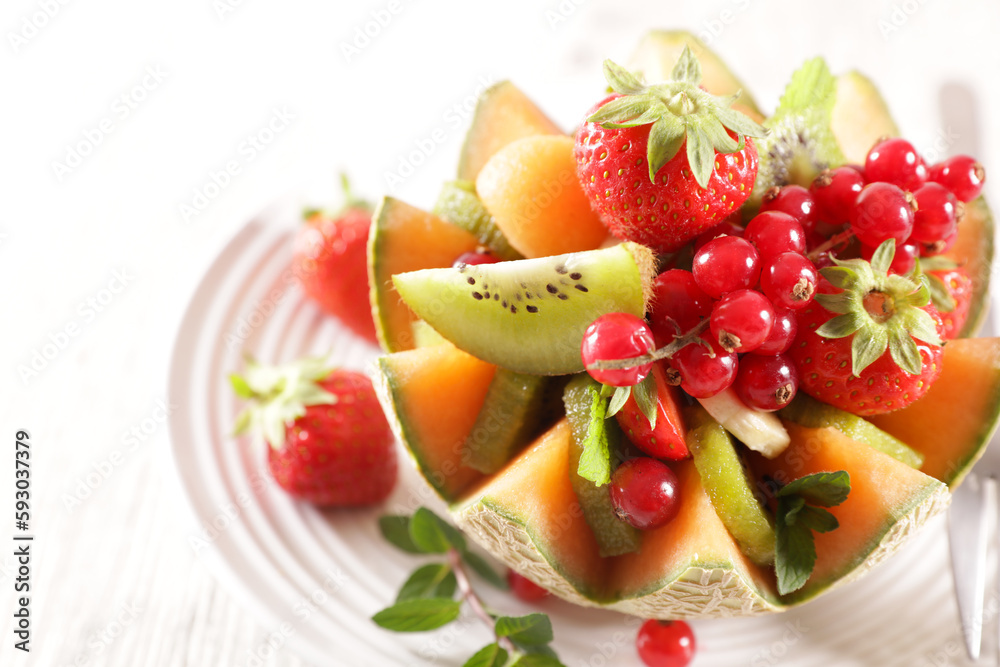 mixed fruit salad in melon bowl