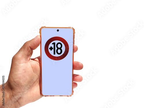 Hand holding a phone with 18 years limitation sign on screen