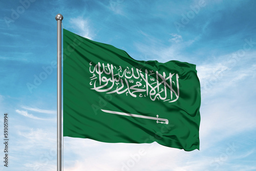 Saudi Arabia national flag cloth fabric waving on beautiful sky Background.