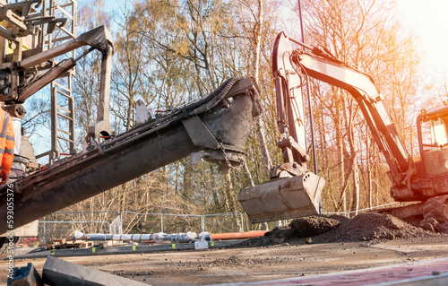 Concrete delivered on the construction site and offloaded from a volumetric concrete mixer photo