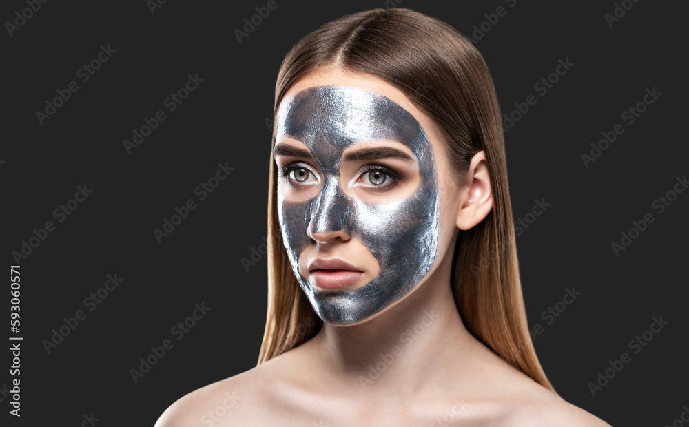 Beautician makes a face mask of a woman to rejuvenate the skin. Cosmetology treatment of problem skin on the face and body. Beautician makes a face mask of a woman to rejuvenate the skin. Cosmetology treatment of problem skin on the face and body.