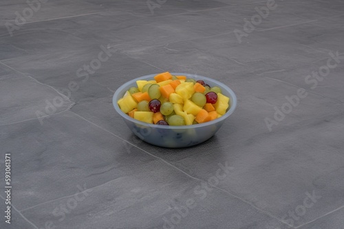 Fruit salad on the background of gray concrete. Great viewpoint. Central repository for copies. Generative AI