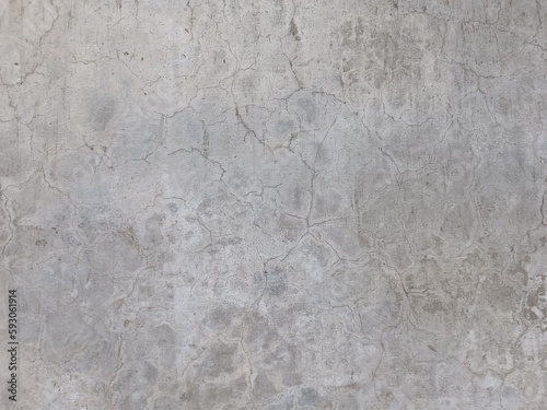 Wall Rough fragment Texture with scratches and cracks.Stucco white wall background.Grey background vintage color and sponged distressed texture in soft blended brush strokes with white grunge.