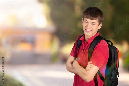 Young funy successful student posing