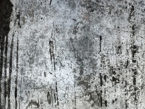 Wall Rough fragment Texture with scratches and cracks.Stucco white wall background.Grey background vintage color and sponged distressed texture in soft blended brush strokes with white grunge.