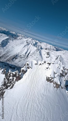 Drone flying thru Norwegian snowy mountains and alps