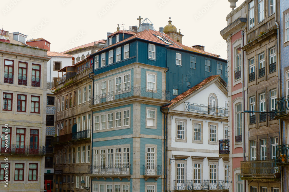 Elegant nostalgic buildings of different faded colours downtown Porto, Portugal