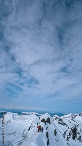 Drone flying thru Norwegian snowy mountains and alps