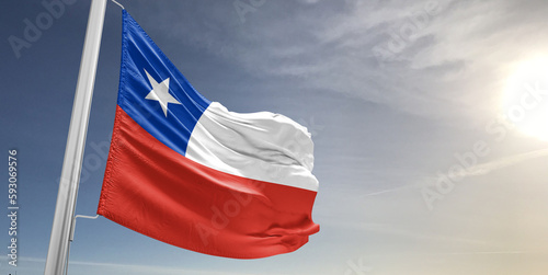 Chile national flag cloth fabric waving on beautiful sky grey Background.