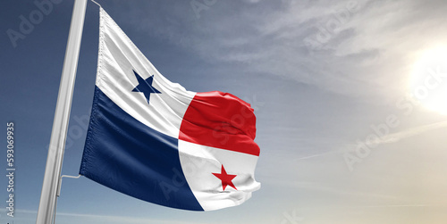 Panama national flag cloth fabric waving on beautiful sky grey Background.