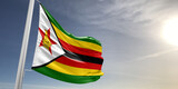 Zimbabwe national flag cloth fabric waving on beautiful sky grey Background.