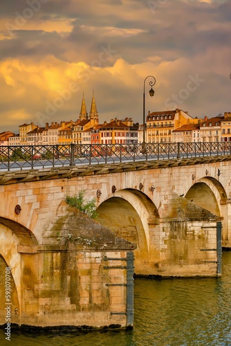 Macon, France - 6/9/2015:  The historic Saint-Laurent Bridge over the Soane river.  It was among the few bridges of the region that were not destroyed during the Second World War. photo